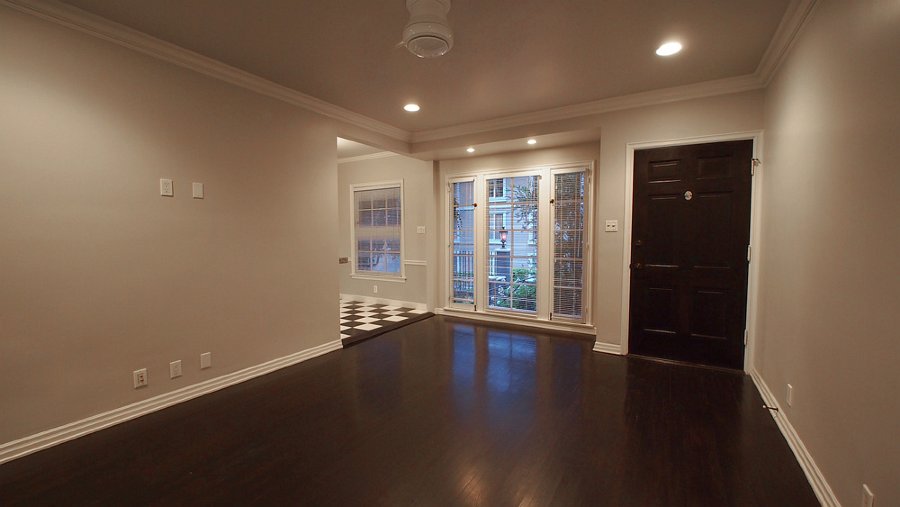 A lovely livingroom with french windows that open into the courtyard